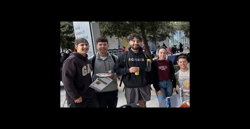 group of people eating pizza